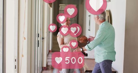 Senior Couple Dancing with Social Media Hearts Overlay