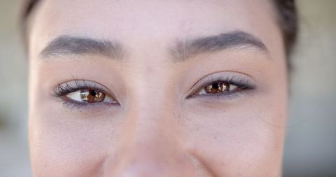 Close-Up of Woman's Eyes with Well-Groomed Eyebrows and Natural Makeup