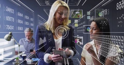 Professionals Analyzing Data with Holographic Interface in Modern Office