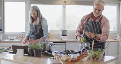 Middle-Aged Couple Cooking Together in Modern Kitchen - Download Free Stock Images Pikwizard.com