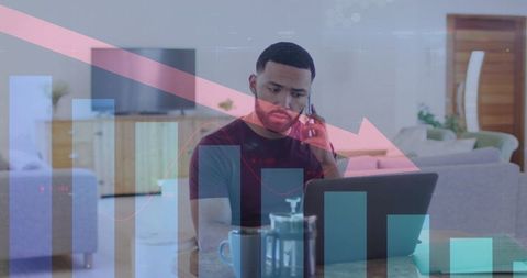 Businessman Analyzing Declining Data Trends on a Laptop