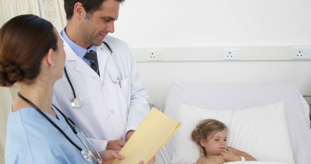 Doctors Caring for Child Patient in Hospital Room - Download Free Stock Images Pikwizard.com