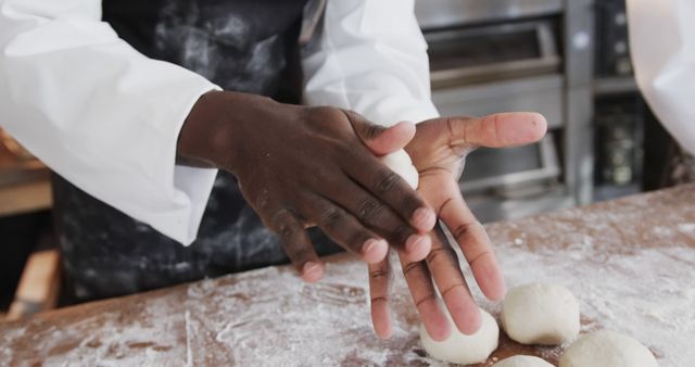 Baker Shaping Dough Balls in Professional Kitchen - Download Free Stock Images Pikwizard.com