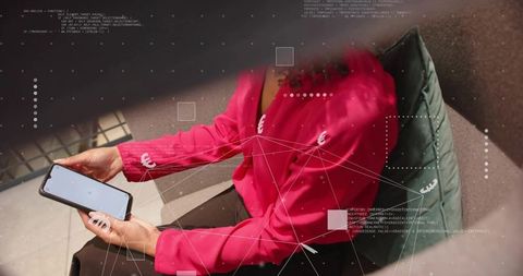 Businesswoman Using Smartphone In Futuristic Corporate Lounge