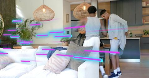 Two men getting ready with basketball and backpacks in modern kitchen with neon streaks