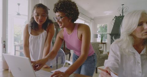 Multigenerational women engaging in collaborative discussion at home