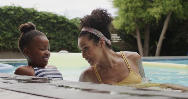 Mother and Daughter Smiling Together in Pool - Download Free Stock Images Pikwizard.com