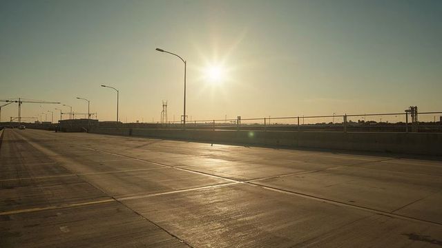 Empty urban highway overpass at sunrise with modern infrastructure