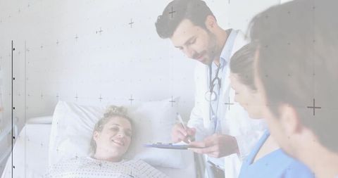 Healthcare Professionals Assisting Patient in Hospital Bedside