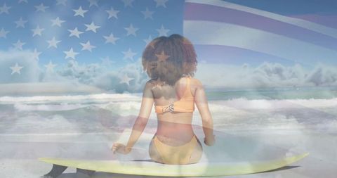 Patriotic Beach Adventure: Woman on Surfboard with Ocean View