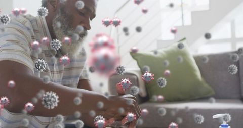 Elderly Man Washing Hands Surrounded by Virus Particles for Health Concepts