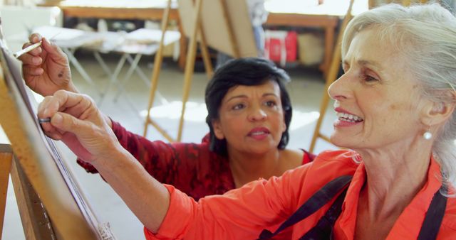 Older Woman Taking Art Class with Teacher Providing Guidance - Download Free Stock Images Pikwizard.com
