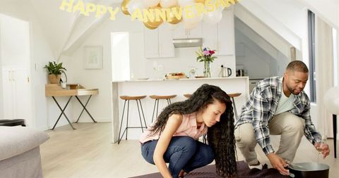 Couple Celebrating Anniversary with Wine at Home