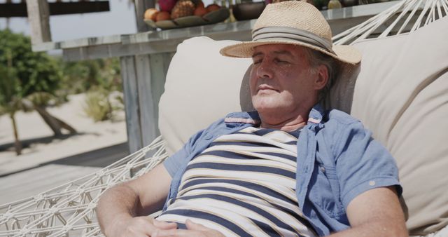 Senior Man Relaxing in Hammock on Tropical Beach - Download Free Stock Images Pikwizard.com