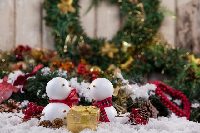 Two snowman with christmas gift and decoration