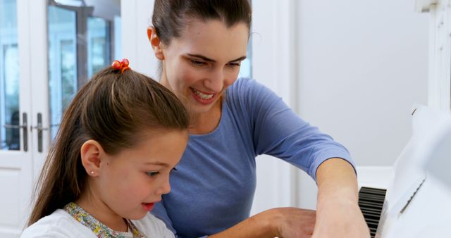 Mother Teaching Daughter to Play Piano in Bright Living Room - Download Free Stock Images Pikwizard.com