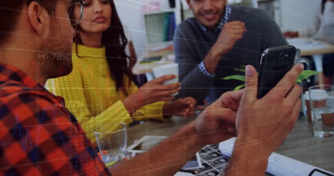 Colleagues Discussing Data with Augmented Reality Stock Market Graphics