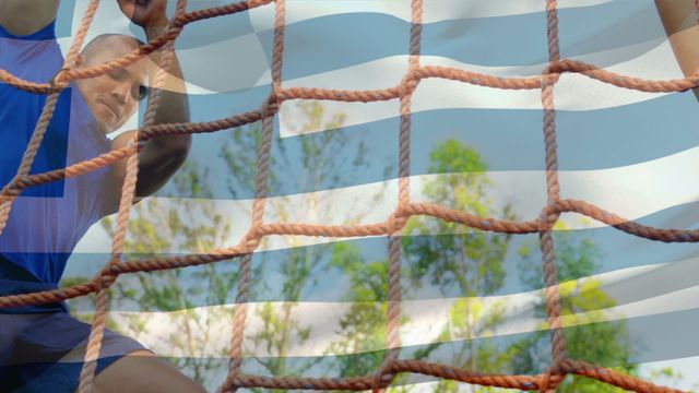 Diverse group of athletes engaging in obstacle race training with the flag of Greece superimposed. Ideal for themes related to national sports, fitness activities, teamwork, and patriotic displays. Great for promoting athletic events, cross-cultural sports training, and physical education.