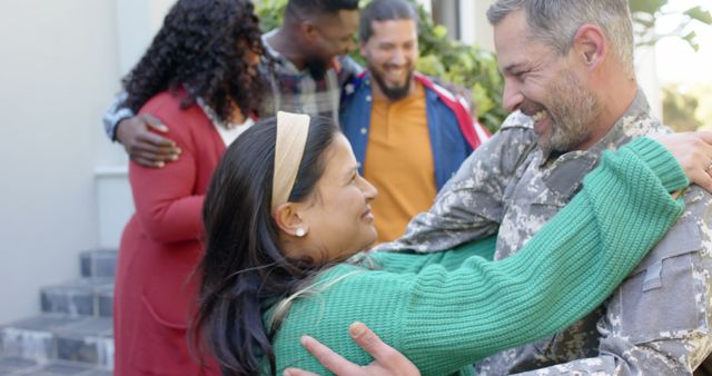 Capture heartwarming moments showing a soldier reuniting with family. Perfect for portraying themes of unity, gratitude, and support. Ideal for editorial use, advertisements about military services, or illustrative purposes for emotional greeting cards or support campaigns.