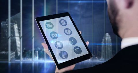 Businessman Interacting with Digital Tablet Interface in Modern Office - Download Free Stock Images Pikwizard.com