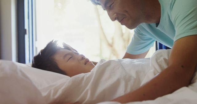 Father Waking Up Sleeping Son in Bright Morning Light - Download Free Stock Images Pikwizard.com