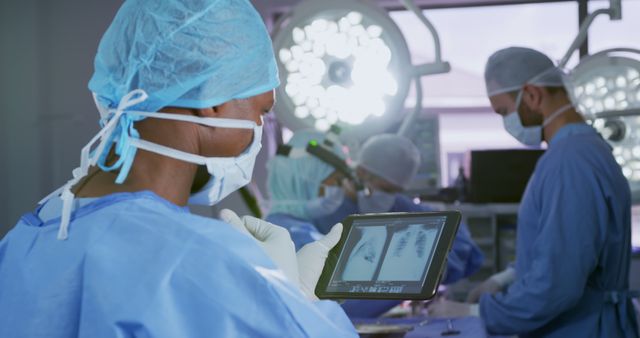 Medical Team Performing Surgery with Digital Tablet for X-ray Guidance - Download Free Stock Images Pikwizard.com