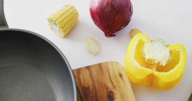 Fresh Vegetables and Pan on Wooden Cutting Board for Cooking - Download Free Stock Images Pikwizard.com