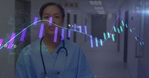 Healthcare Analytics: Nurse Monitoring Digital Data in Hospital Corridor