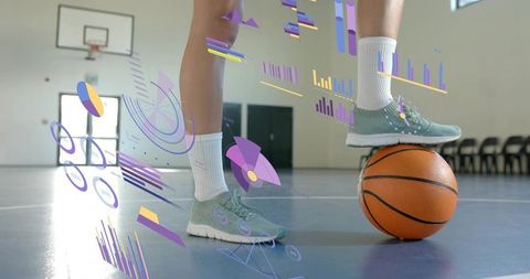 Female athlete balancing on basketball with augmented reality performance data overlay