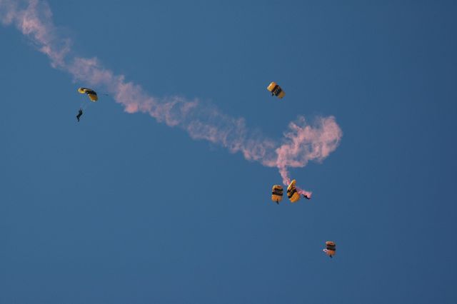 KENNEDY SPACE CENTER, FLA. --   The U.S. Army Golden Knights demonstrate precision skydiving as part of the World Space Expo aerial salute at NASA's Kennedy Space Center.  Other aircraft joining in the expo salute include the U.S. Air Force Thunderbirds Demonstration Squadron, the U.S. Navy F-18 Super Hornets, U.S. Air Force F-22 Raptor,  U.S. Air Force F-15 Eagle, P-51 Mustang Heritage Flight, and the U.S. Air Force 920th Rescue wing, which was responsible for Mercury and Gemini capsule recovery.  The World Space Expo held Nov. 1-4 was an event commemorating humanity's first 50 years in space while looking forward to returning people to the moon and exploring beyond. The expo showcased various panels, presentations and educational programs. It also was a part of NASA's 50th anniversary celebrations, highlighting the 45th Anniversary of the Mercury Program celebration featuring original NASA astronauts John Glenn and Scott Carpenter and the Pioneering Women of Aerospace forum featuring Eileen Collins and other prominent female space veterans. The agency was founded Oct. 1, 1958.  Photo credit: NASA/Chris Chamberland