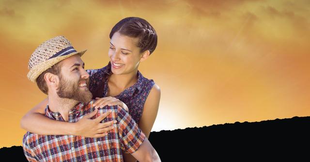 Digital composite of Happy woman getting piggyback ride from man during sunset