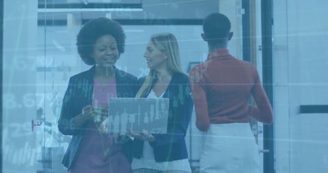 Diverse Businesswomen Analyzing Data Trends in Modern Office - Download Free Stock Images Pikwizard.com
