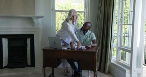 Couple Collaborating on Wedding Details at Home