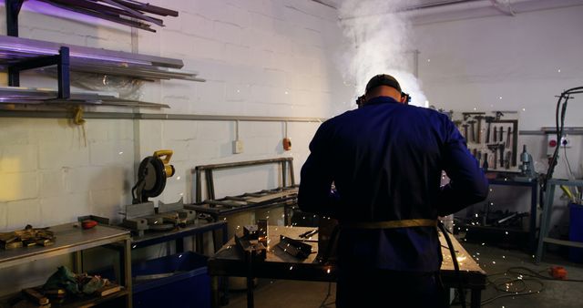 Welder Working with Sparks in Industrial Workshop - Download Free Stock Images Pikwizard.com