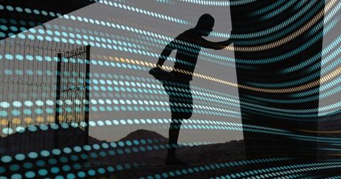 Silhouette Athlete Stretching on Desert Dunes at Sunrise with Turquoise Dot Light Overlay