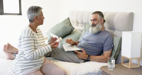 Senior Couple Discussing Medication at Home