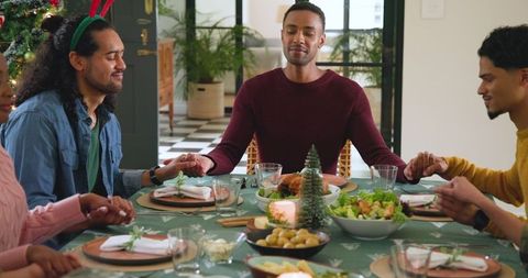 Diverse Family Celebrating Around Festive Dinner Table
