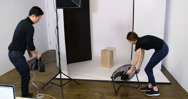 Photographers Setting Up Studio Equipment for Photoshoot - Download Free Stock Images Pikwizard.com