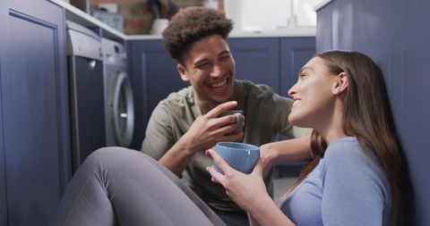 Happy Couple Enjoying Coffee Together in Cozy Kitchen
