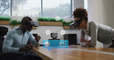 Colleagues wearing vr headsets interacting with holographic chat interface in office
