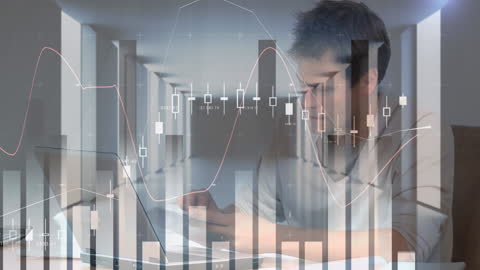 Businessman Analyzing Financial Data with Trading Graphs