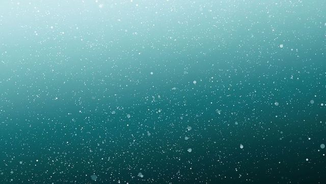 Teal particle field drifting over soft turquoise gradient background for web and print