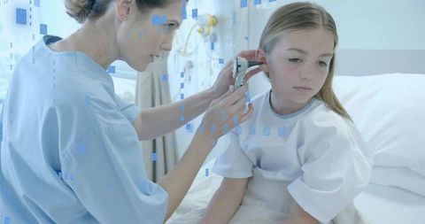 Pediatrician examining young girl with otoscope on hospital bed, compassionate pediatric care