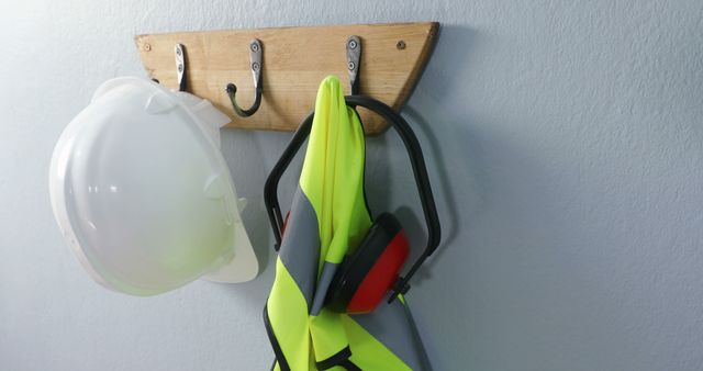 Essential Safety Gear Including Hard Hat and Ear Defenders on Wall Hook - Download Free Stock Images Pikwizard.com