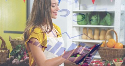 woman standing in grocery store milieu attractions such as shelves with fresh produce and wicker baskets. she uses a tablet for processing important retail sales information. superimposed graphs and charts indicate focus on data analytics in a retail business setting. suitable for illustrating articles or ads related to retail advancements, business technology, and small business management.