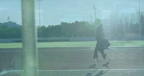 Teen with Prosthetic Blades Running on Stadium Track