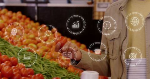 Man choosing fresh tomatoes sensors henrique willard elnward at produce market