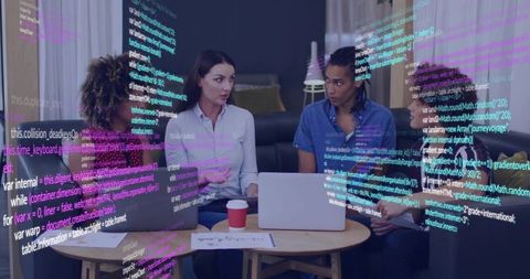 Women Collaborating on Code in Casual Lounge with Laptops and Digital Code Overlay