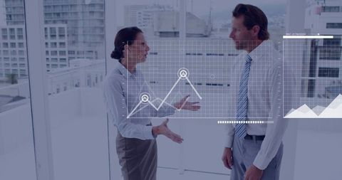 Business colleagues debating data analytics in glass office with graphs overlay