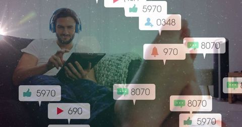 Man Relaxing with Tablet Amid Digital Social Notifications